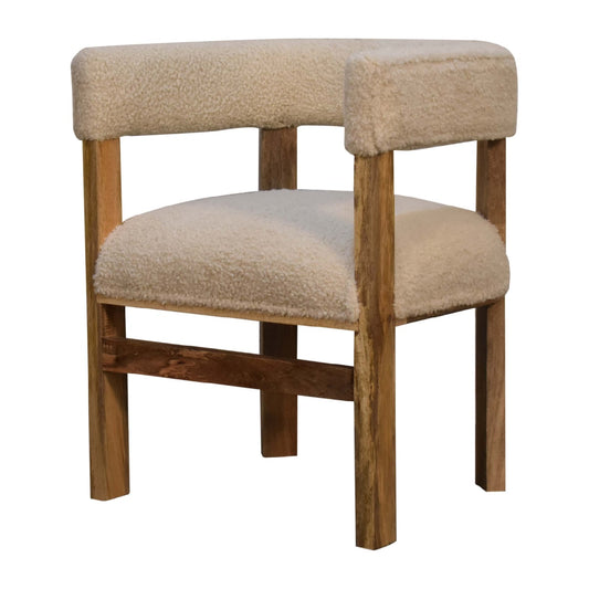 cream boucle upholstered chair with solid wood frame