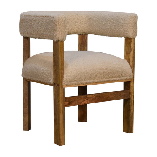 side view cream boucle upholstered chair with solid wood frame