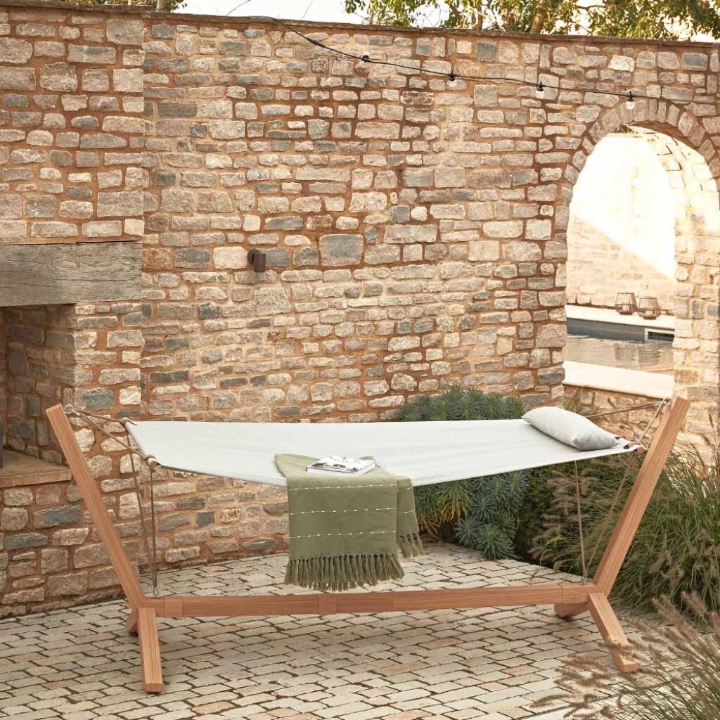 swinging hammock in walled garden setting