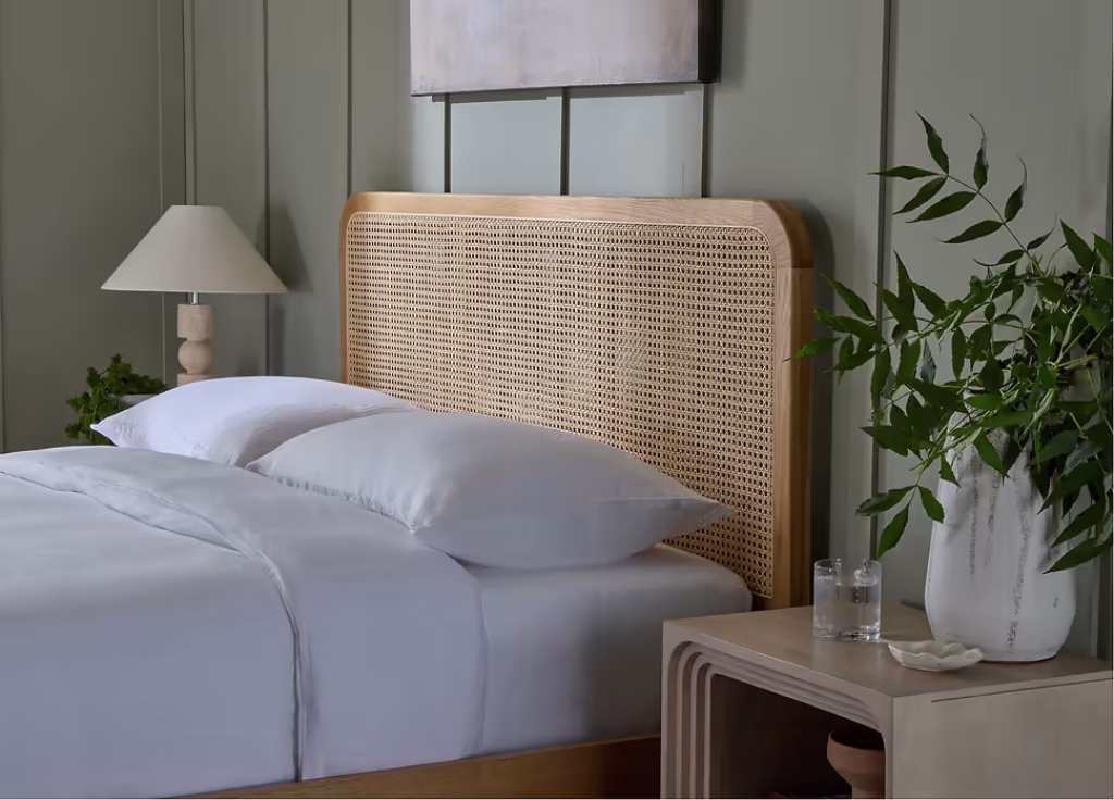 How to Create a Sustainable Bedroom: A Practical Guide Fernley wood bed close up of the rattan headboard.