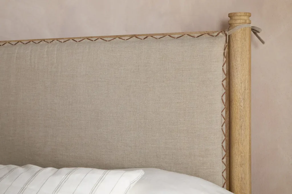 How to Create a Sustainable Bedroom: A Practical Guide Close up of the Sri Wood Bed headboard by Nkuku in mango wood