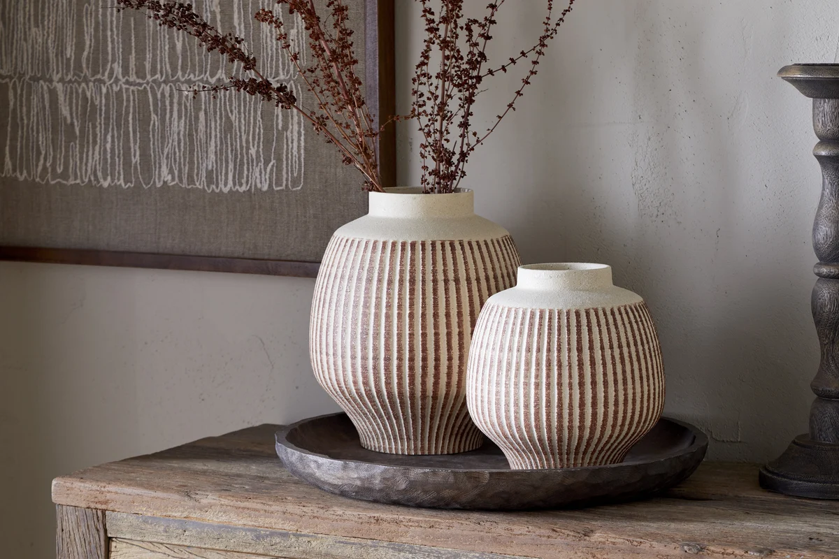Reactive glae vases in terracotta and white.