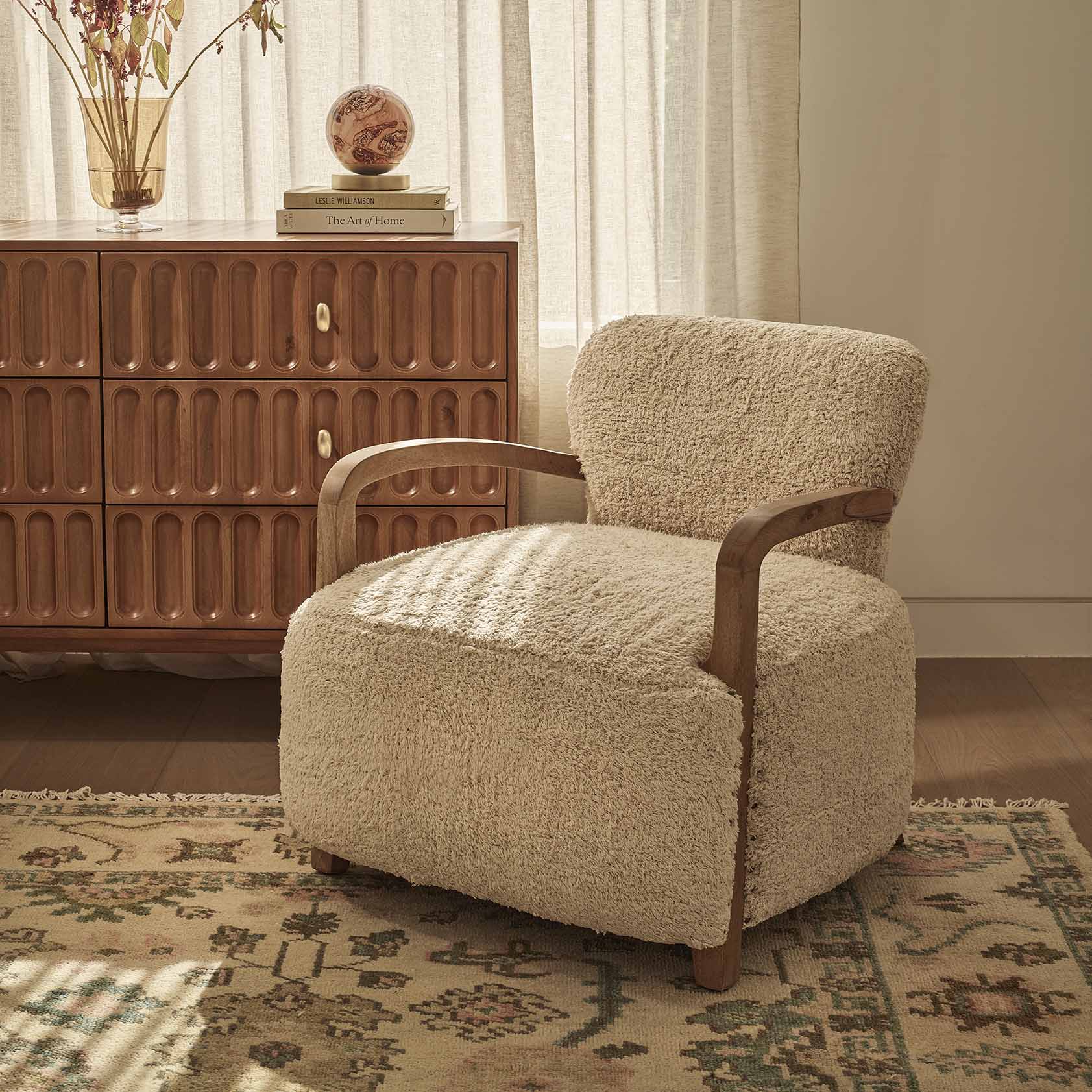 Textured cotton rug armchair with curved wooden arms in natural oak 