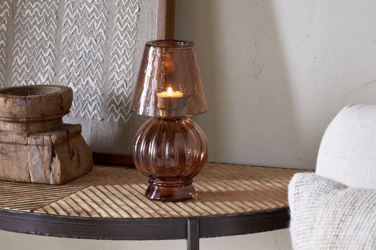 Autumn Winter Home Trends 2026: A Sustainable Edit Glass tealight holder in amber with tealight in the shape of a lamp.