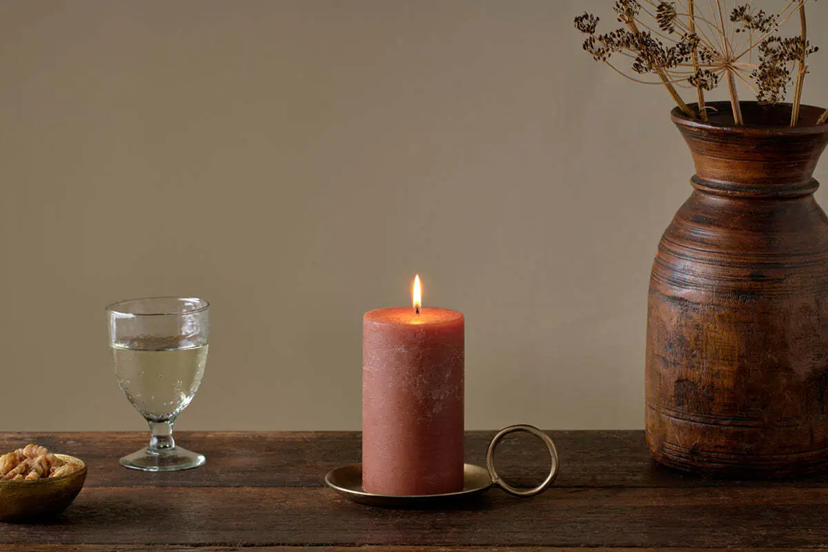 Autumn Winter Home Trends 2026: A Sustainable Edit soy blend wax candle in rust colour.