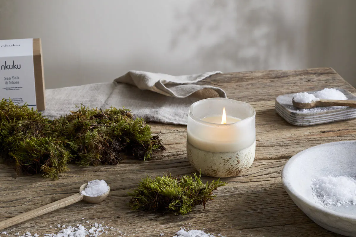 Autumn Winter Home Trends 2026: A Sustainable Edit Sea salt and moss scented candle in recycled glass container.