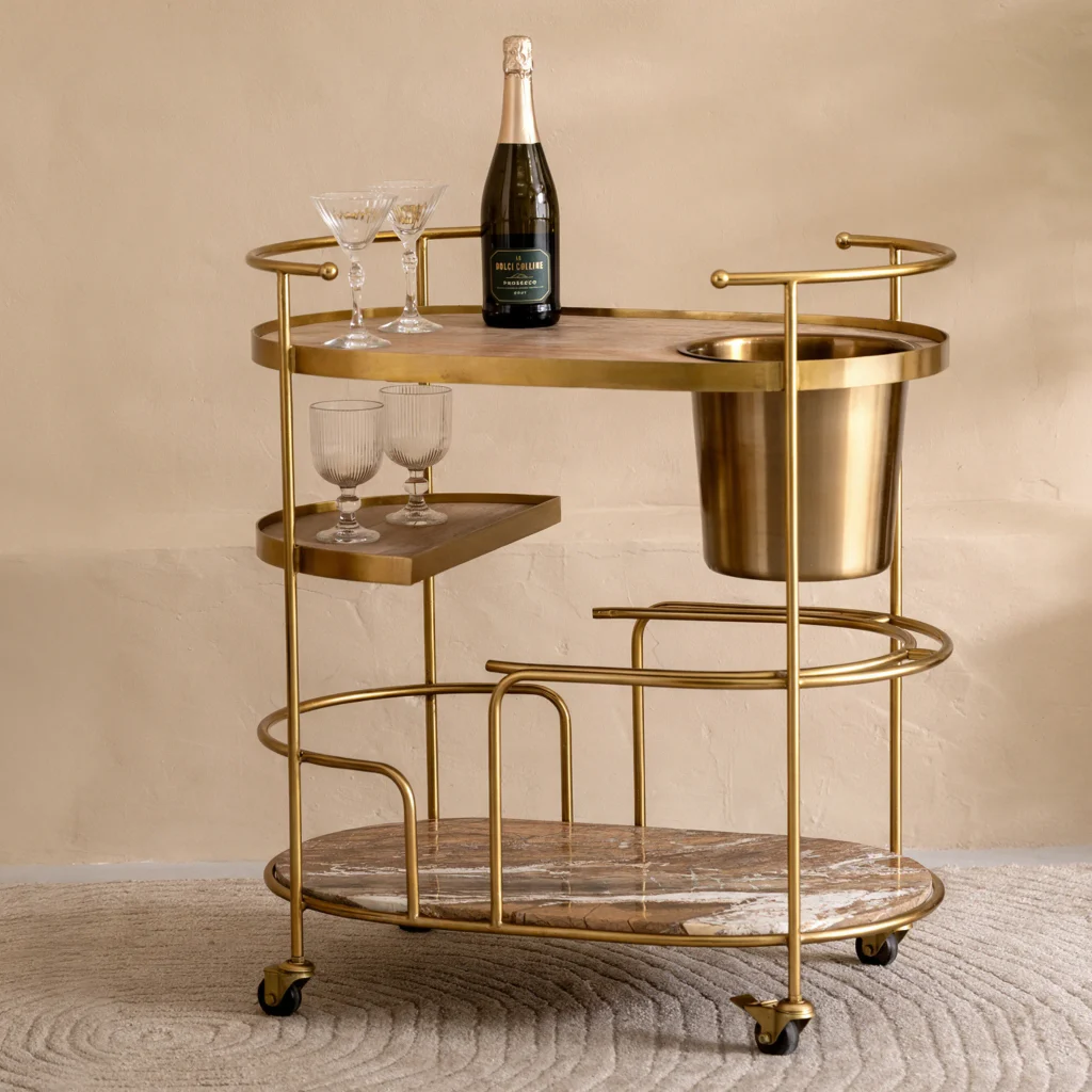 Autumn Winter Home Trends 2026: A Sustainable Edit Brass drinks trolley with champagne bottle and glasses.