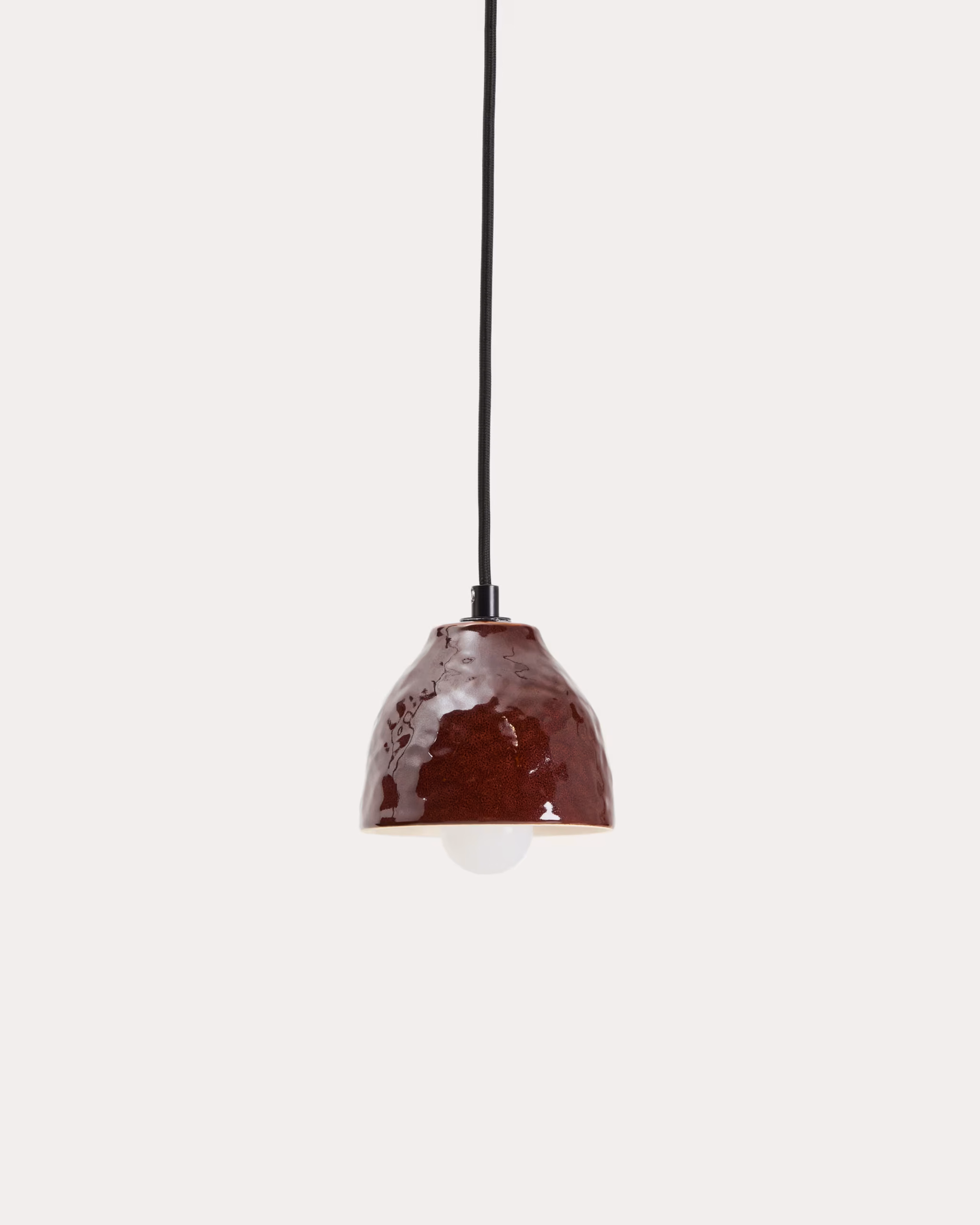 Autumn Winter Home Trends 2026: A Sustainable Edit Ceiling light in burgundy ceramic.