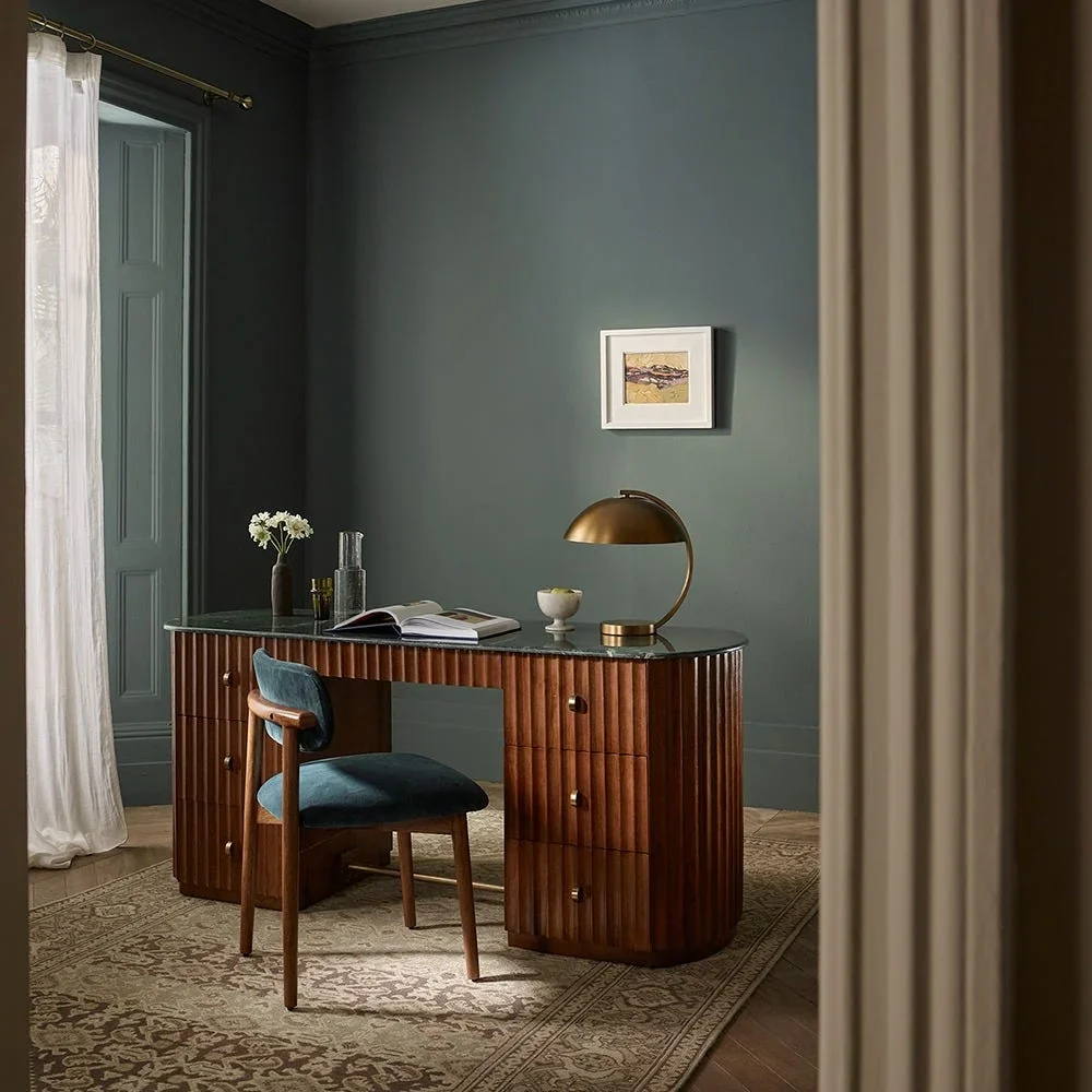 Autumn Winter Home Trends 2026: A Sustainable Edit Jude Large Fluted Marble Desk in warm toned mango wood with an expansive top made from solid green veined marble.
