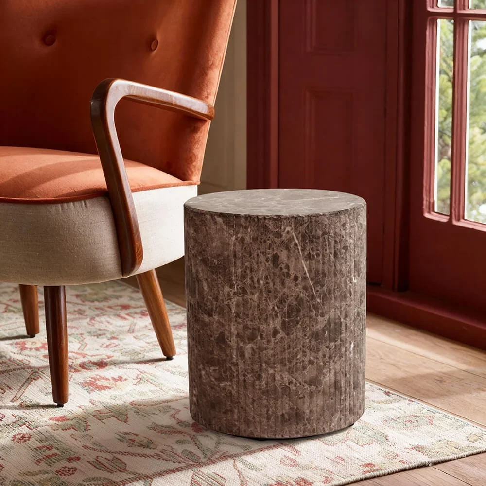 Autumn Winter Home Trends 2026: A Sustainable Edit Side table fluted made from brown veined marble.